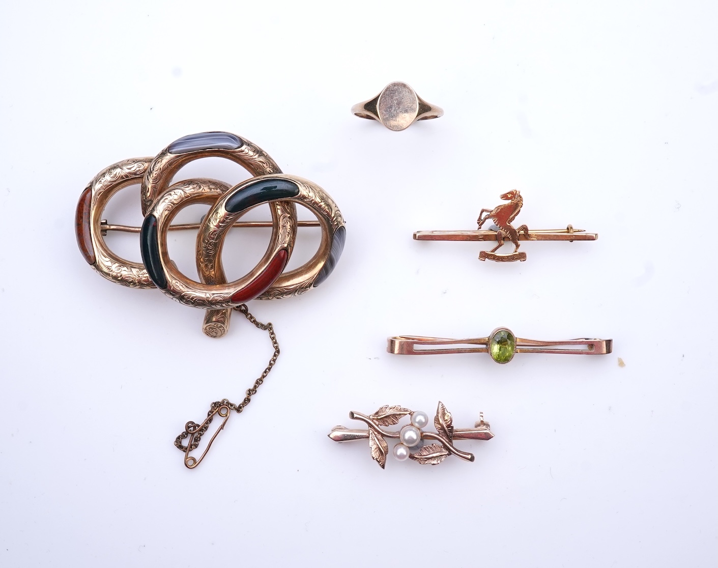 Four brooches and a gold signet ring